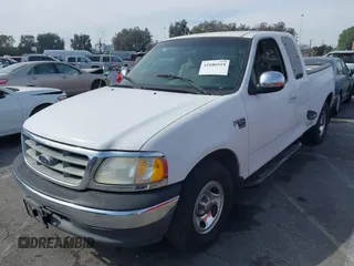 2001 Ford F-150 XL with VIN 1FTRX07L91KA77460, listed as a IAAI auction lot 41686519 with 185,286 mi miles. Bid and sale history available at carsss.com. Image 2.
