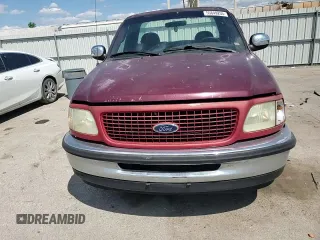 1998 Ford F-150 z VIN 1FTZF17W1WNA59477, wystawiony jako Copart lot #55849255 z przebiegiem 107 471 mil mil oraz Szkoda całkowita • Salvage title. Historia ofert i sprzedaży dostępna na DreamBid. Obrazek 13.
