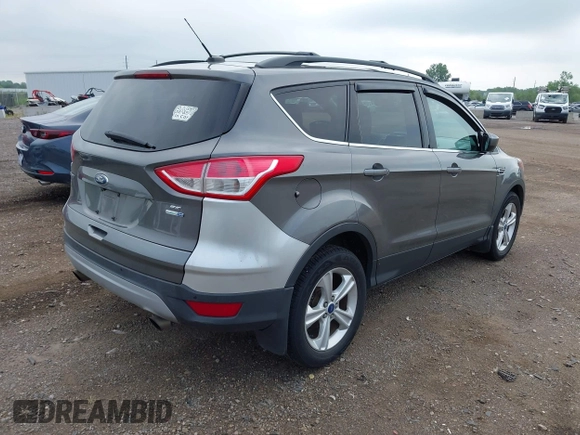 2014 Ford Escape SE with VIN 1FMCU9GX4EUA83808, listed as a IAAI auction lot 42576737 with 116,074 mi miles and . Bid and sale history available at DreamBid. Image 4.