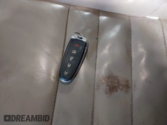 2014 Ford Escape Titanium with VIN 1FMCU9J90EUC31625, listed as a IAAI auction lot 41492075 with 301,917 mi miles and . Bid and sale history available at DreamBid. Image 11.