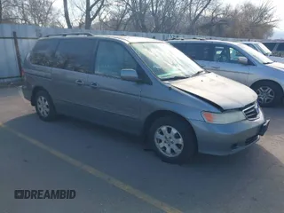 2002 Honda Odyssey EX z VIN 5FNRL186X2B014652, wystawiony jako IAAI lot #41950225 z przebiegiem 286 959 mil mil oraz . Historia ofert i sprzedaży dostępna na DreamBid. Obrazek 1.