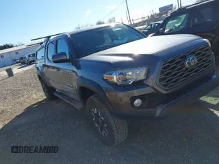 2021 Toyota Tacoma 4WD SR5 with VIN 5TFDZ5BN8MX058531, listed as a IAAI auction lot 41628820 with 102,004 mi miles. Bid and sale history available at carsss.com. Image 1.