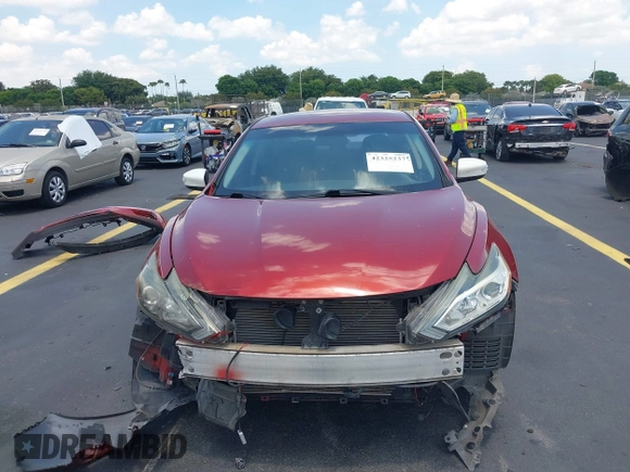 2016 Nissan Altima S z VIN 1N4AL3AP4GN353532, wystawiony jako IAAI lot #42325237 z przebiegiem 165 624 mil mil oraz . Historia ofert i sprzedaży dostępna na DreamBid. Obrazek 13.