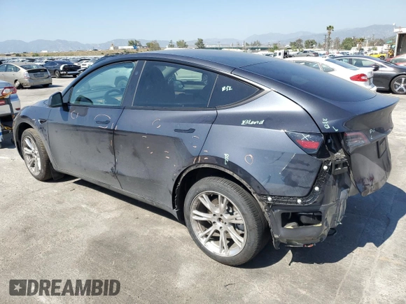 2024 Tesla Model Y Long Range z VIN 7SAYGDEE5RA244641, wystawiony jako Copart lot #51864845 z przebiegiem 23 096 mil mil oraz Szkoda całkowita • Salvage title. Historia ofert i sprzedaży dostępna na DreamBid. Obrazek 2.