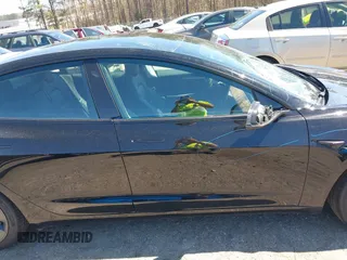 2022 Tesla Model 3 Long Range with VIN 5YJ3E1EB3NF104313, listed as a IAAI auction lot 41832803 with 39,061 mi miles and . Bid and sale history available at DreamBid. Image 13.