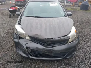 2013 Toyota Yaris L with VIN JTDJTUD39DD560766, listed as a IAAI auction lot 41031127 with 57,831 mi miles. Bid and sale history available at carsss.com. Image 12.