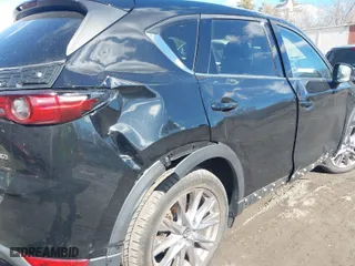 2021 Mazda CX-5 Grand Touring with VIN JM3KFBDM3M1318248, listed as a IAAI auction lot 41678260 with 71,903 mi miles. Bid and sale history available at carsss.com. Image 6.