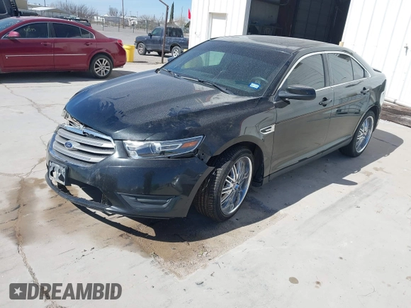 2014 Ford Taurus SEL with VIN 1FAHP2E83EG184976, listed as a IAAI auction lot 41590153 with 177,342 mi miles. Bid and sale history available at carsss.com. Image 2.