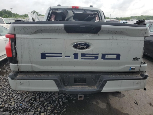 2023 Ford F-150 Lightning Pro with VIN 1FTVW1EL9PWG58758, listed as a Copart auction lot 64410814 with 0 mi miles and Salvage Title. Bid and sale history available at carsss.com. Image 6.