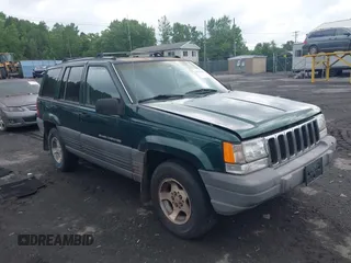 1996 Jeep Grand Cherokee z VIN 1J4EZ58Y7TC128302, wystawiony jako IAAI lot #42643449 z przebiegiem 282 036 mil mil oraz . Historia ofert i sprzedaży dostępna na DreamBid. Obrazek 1.