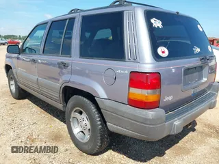 1996 Jeep Grand Cherokee with VIN 1J4EZ58S5TC149533, listed as a IAAI auction lot 42456529 with 173,872 mi miles and . Bid and sale history available at DreamBid. Image 3.