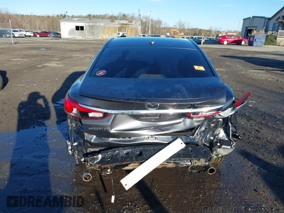 2014 Mazda 6 i Grand Touring with VIN JM1GJ1W50E1107877, listed as a IAAI auction lot 41857596 with 166,188 mi miles and . Bid and sale history available at DreamBid. Image 17.