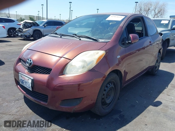 2010 Toyota Yaris with VIN JTDJT4K38A5324103, listed as a IAAI auction lot 41964619 with 149,874 mi miles. Bid and sale history available at carsss.com. Image 2.