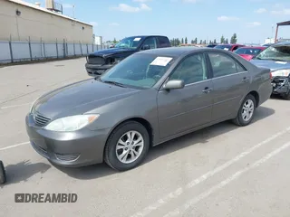 2005 Toyota Camry LE with VIN 4T1BF32K35U590150, listed as a IAAI auction lot 42053337 with 180,627 mi miles and . Bid and sale history available at DreamBid. Image 2.