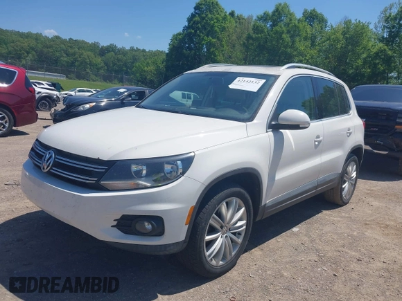 2013 Volkswagen Tiguan SE with VIN WVGAV7AX4DW528410, listed as a IAAI auction lot 42142132 with 148,511 mi miles and . Bid and sale history available at DreamBid. Image 2.