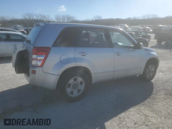 2006 Suzuki Grand Vitara z VIN JS3TE941364101882, wystawiony jako Copart lot #84143364 z przebiegiem 148 560 mil mil oraz Szkody całkowita. Historia ofert i sprzedaży dostępna na DreamBid. Obrazek 3.