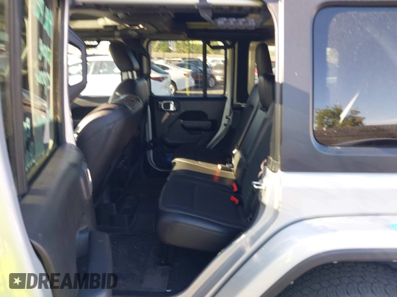 2023 Jeep Wrangler Willys with VIN 1C4HJXDG3PW577807, listed as a IAAI auction lot 42323674 with 28,808 mi miles and . Bid and sale history available at DreamBid. Image 8.