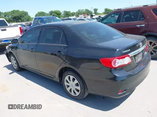 2011 Toyota Corolla L with VIN JTDBU4EE9BJ096586, listed as a IAAI auction lot 41992120 with 201,297 mi miles. Bid and sale history available at carsss.com. Image 3.
