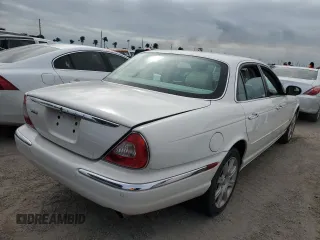 2004 Jaguar XJ with VIN SAJWA71C44SG34094, listed as a Copart auction lot 74969004 with 0 mi miles and Salvage Title. Bid and sale history available at carsss.com. Image 3.