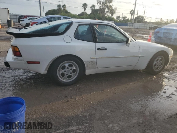 1987 Porsche 944 z VIN WP0AB0948HN473051, wystawiony jako Copart lot #73666654 z przebiegiem 82 580 mil mil oraz Szkoda całkowita • Salvage title. Historia ofert i sprzedaży dostępna na DreamBid. Obrazek 3.