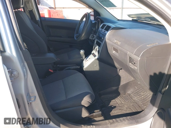 2009 Dodge Caliber SXT with VIN 1B3HB48A99D143067, listed as a IAAI auction lot 40989643 with 132,534 mi miles and . Bid and sale history available at carsss.com. Image 5.