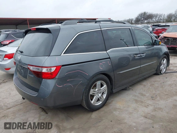2012 Honda Odyssey Touring with VIN 5FNRL5H96CB138548, listed as a IAAI auction lot 41471856 with 186,284 mi miles and . Bid and sale history available at DreamBid. Image 4.