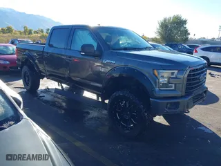 2015 Ford F-150 XLT w/HD Payload Pkg with VIN 1FTFW1EF9FKD48453, listed as a IAAI auction lot 40694465 with 129,707 mi miles. Bid and sale history available at carsss.com. Image 1.