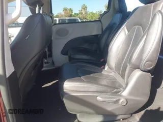 2021 Chrysler Pacifica Hybrid Touring L with VIN 2C4RC1L76MR581285, listed as a IAAI auction lot 42303222 with 77,808 mi miles and . Bid and sale history available at DreamBid. Image 8.