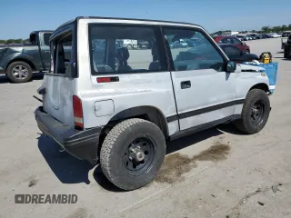 1991 Geo Tracker z VIN 2CNBJ18U3M6909006, wystawiony jako Copart lot #73638944 z przebiegiem 65 033 mil mil oraz Tytuł czysty. Historia ofert i sprzedaży dostępna na DreamBid. Obrazek 3.