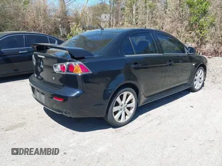 2012 Mitsubishi Lancer GT with VIN JA32U8FW6CU021485, listed as a IAAI auction lot 42159256 with 138,455 mi miles. Bid and sale history available at carsss.com. Image 4.