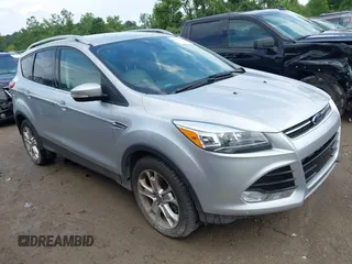 2016 Ford Escape Titanium z VIN 1FMCU9J95GUB93585, wystawiony jako IAAI lot #42614106 z przebiegiem 124 465 mil mil oraz . Historia ofert i sprzedaży dostępna na DreamBid. Obrazek 1.