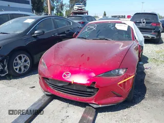 2021 Mazda MX-5 Miata Grand Touring с VIN JM1NDAM71M0459437, выставлен на аукционе IAAI как лот 41808704 с пробегом 19 368 миль миль и . История ставок и продаж доступна на DreamBid. Изображение 13.