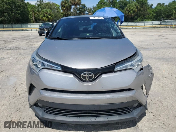 2018 Toyota C-HR XLE with VIN NMTKHMBX7JR021704, listed as a Copart auction lot 71171874 with 82,872 mi miles and Salvage Title. Bid and sale history available at DreamBid. Image 5.