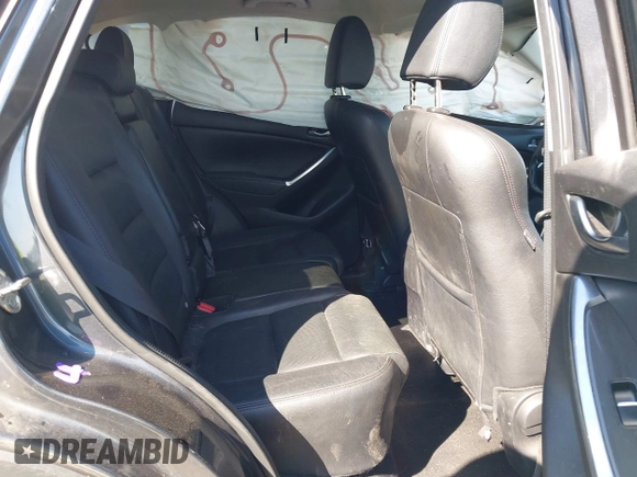 2016 Mazda CX-5 Grand Touring with VIN JM3KE4DY8G0823567, listed as a IAAI auction lot 41784384 with 143,836 mi miles and . Bid and sale history available at carsss.com. Image 8.