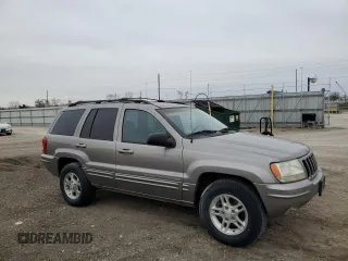 1999 Jeep Grand Cherokee Limited with VIN 1J4GW68SXXC582343, listed as a Copart auction lot 51067695 with 157,456 mi miles and Clean Title. Bid and sale history available at carsss.com. Image 4.