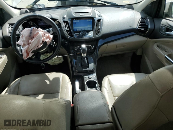 2016 Ford Escape Titanium with VIN 1FMCU9J94GUB31594, listed as a Copart auction lot 51690565 with 119,699 mi miles and Salvage Title. Bid and sale history available at DreamBid. Image 8.