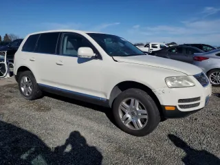 2004 Volkswagen Touareg z VIN WVGCM77L04D040938, wystawiony jako Copart lot #45434315 z przebiegiem 140 769 mil mil oraz Czysty tytuł • Clean title. Historia ofert i sprzedaży dostępna na DreamBid. Obrazek 4.