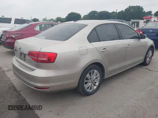 2015 Volkswagen Jetta Sedan 1.8T SE w/Connectivity with VIN 3VWD07AJ0FM231873, listed as a IAAI auction lot 42142327 with 156,230 mi miles. Bid and sale history available at carsss.com. Image 4.
