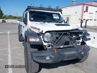 2022 Jeep Gladiator Mojave with VIN 1C6JJTEG0NL103523, listed as a IAAI auction lot 41842011 with 36,160 mi miles and . Bid and sale history available at DreamBid. Image 1.