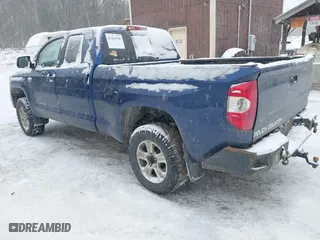 2014 Toyota Tundra 4WD Truck SR with VIN 5TFUY5F18EX392859, listed as a IAAI auction lot 41264709 with 186,881 mi miles. Bid and sale history available at carsss.com. Image 3.