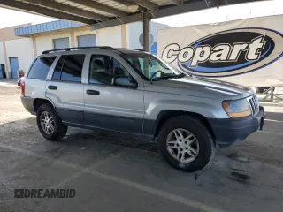 2003 Jeep Grand Cherokee Laredo with VIN 1J4GW48S23C617830, listed as a Copart auction lot 57481565 with 122,745 mi miles and Salvage title. Bid and sale history available at DreamBid. Image 4.