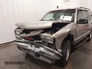 1999 GMC Yukon with VIN 1GKEK13R7XJ723255, listed as a IAAI auction lot 41879617 with 148,324 mi miles. Bid and sale history available at carsss.com. Image 6.
