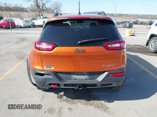 2016 Jeep Cherokee Trailhawk with VIN 1C4PJMBBXGW251682, listed as a IAAI auction lot 41973696 with 100,411 mi miles. Bid and sale history available at carsss.com. Image 17.