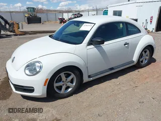 2012 Volkswagen Beetle Entry PZEV with VIN 3VWFP7AT2CM646744, listed as a IAAI auction lot 41963974 with 149,984 mi miles. Bid and sale history available at carsss.com. Image 2.