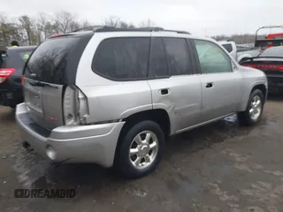 2004 GMC Envoy SLT with VIN 1GKDT13S242398113, listed as a IAAI auction lot 41722942 with 175,173 mi miles and . Bid and sale history available at DreamBid. Image 4.
