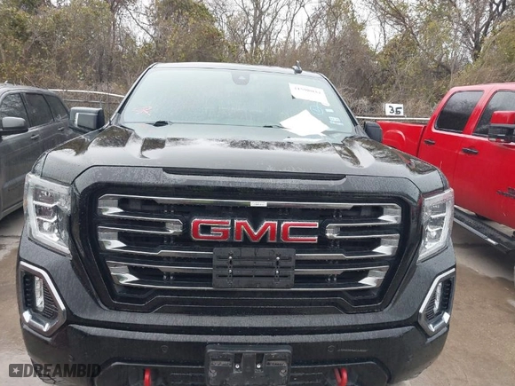 2019 GMC Sierra 1500 AT4 with VIN 1GTP9EEDXKZ144019, listed as a IAAI auction lot 41598034 with 106,046 mi miles. Bid and sale history available at carsss.com. Image 6.