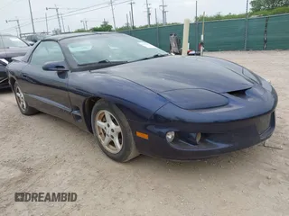 1999 Pontiac Firebird Firebird z VIN 2G2FS22K2X2232076, wystawiony jako IAAI lot #42147131 z przebiegiem 106 375 mil mil oraz . Historia ofert i sprzedaży dostępna na DreamBid. Obrazek 1.
