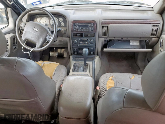 2004 Jeep Grand Cherokee with VIN 1J8GX58J54C121513, listed as a Copart auction lot 59384005 with 221,397 mi miles and Salvage title. Bid and sale history available at DreamBid. Image 8.