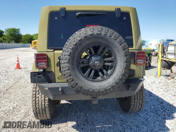 2013 Jeep Wrangler Unlimited Rubicon with VIN 1C4BJWFG0DL587057, listed as a Copart auction lot 57362535 with 102,684 mi miles and Salvage title. Bid and sale history available at DreamBid. Image 6.