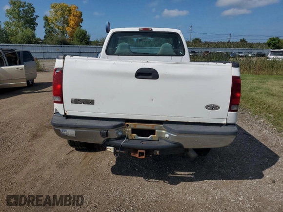 1999 Ford Super Duty F-250 XL with VIN 1FTNF21F8XED38956, listed as a Copart auction lot 69384214 with 143,127 mi miles and Salvage Title. Bid and sale history available at carsss.com. Image 6.